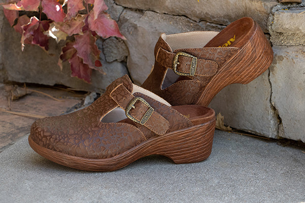 Brown Beauties, featuring Selina Tawny Delicut, wood look wedge clog with embossed leather upper and adjustable buckle trimmed strap.