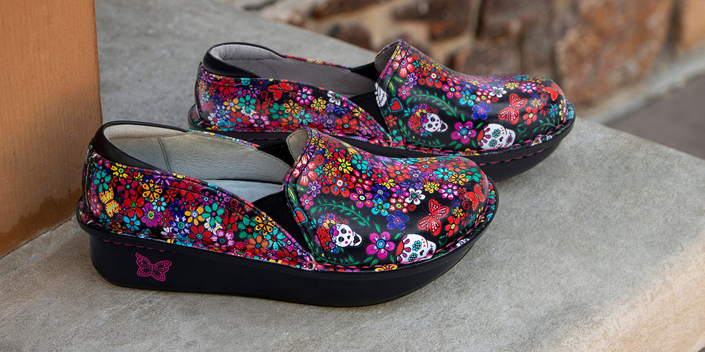 Debra Ofrenda professional shoe, with hand-drawn exclusive print on classic rocker outsole. Patented footbed provides support for all-day wear. DEB-7574