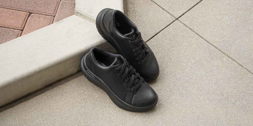 Lace up in a sneaker that will keep you supported all day. This style features a vegan leather upper, adjustable laces, a padded collar and dual built-in arch support. FLO-7441 BLACK 