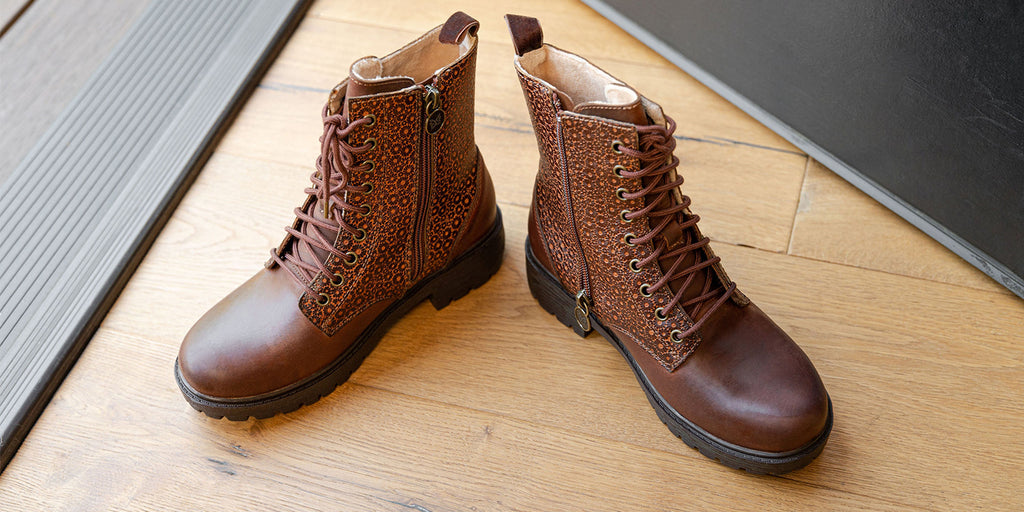 Ari Cinnamon Girl lace-up boot on a luxe lug outsole with a brown embossed leather shaft. ARI-7614