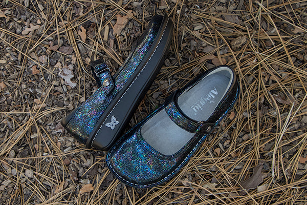 Shop Belle collection, featuring Belle That's Fetch printed design on genuine leather with Mini outsole and patented footbed design.