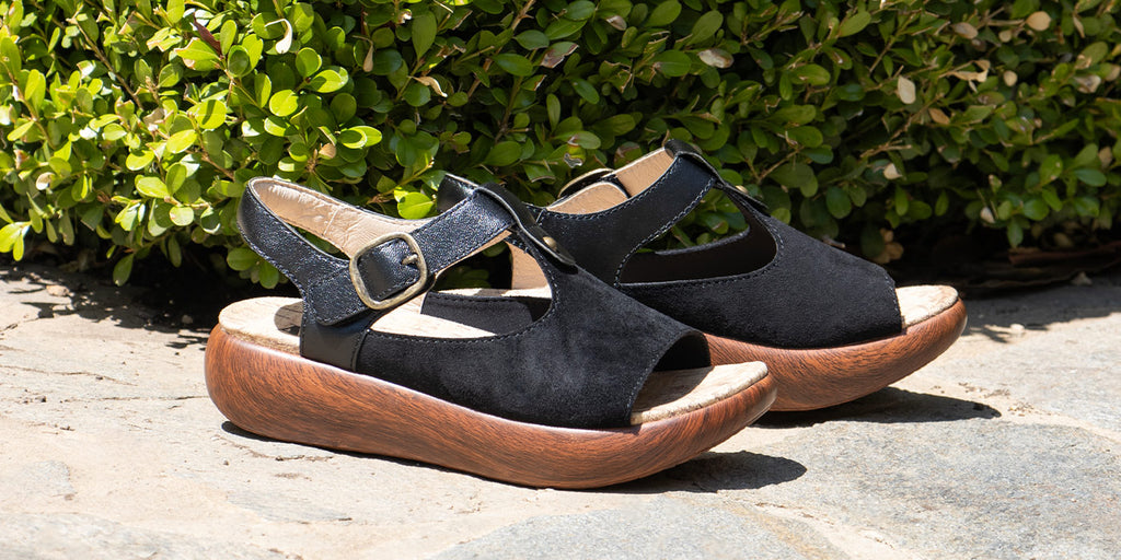 Betsie Stretch Black sandal on sleek rocker outsole.
