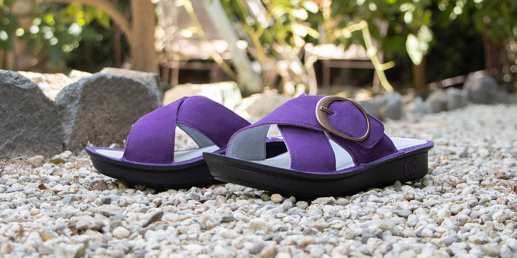 Vella Deep Amethyst slide sandal with adjustable criss cross straps on mini outsole with patented Alegria footbed design.