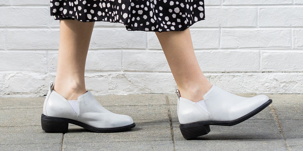 Merle Silver White Bootie with trimform heel outsole and Signature Arch™ footbed underfoot.