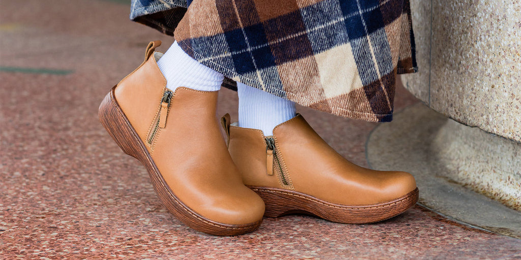 Oaklee Rancho boot on wood look rocker outsole.