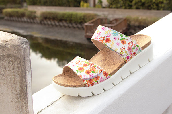 Rubie Prime Time sandal, with two hook-and-loop adjustable straps on a printed polyurethane footbed to look like cork.  Built on the heritage outsole, the molded construction includes built-in arch support shaping for maximum underfoot support.