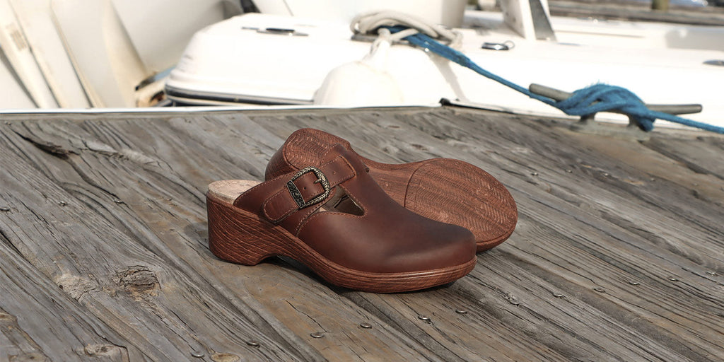 Selina burnish tawny wedge clog with wood-look wedge outsole.