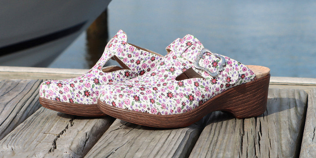 Selina Precious clog on the the wood look wedge outsole with durable microsuede lined footbed