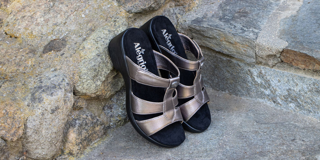 Shantal Pewter wedge sandal with adjustable hook and loop closures.