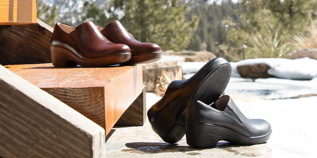 The new leather shootie detailed for comfort with side gores and a padded collar. On a slip-resistant wood-look-wedge-outsole. In a Mahogany SKY-8157 brown, and Noir SKY-8156 black.