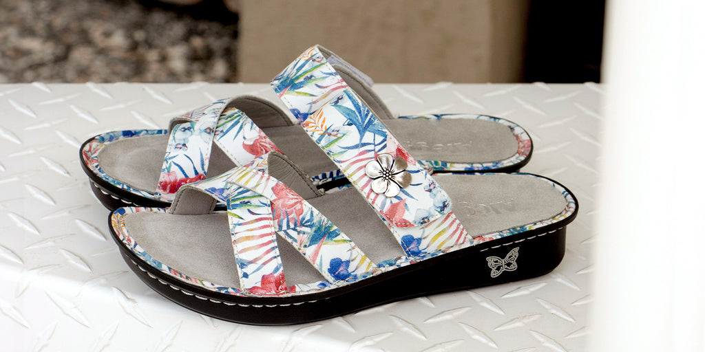 Victoriah Tropics sandal on mini outsole with removable patented footbed design.