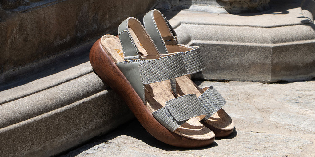 Bailee woven sage sandal with adjustable straps on sleek rocker outsole.