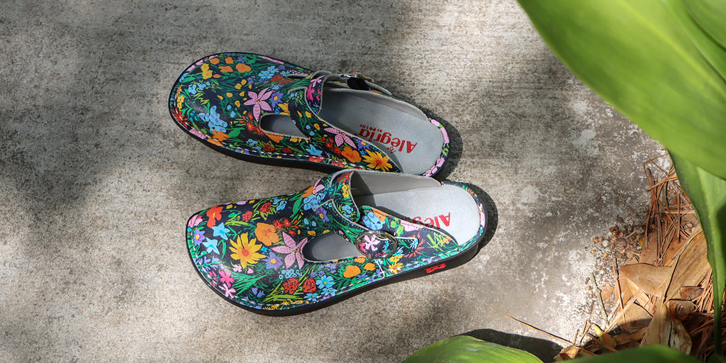 Classic Sweet Emotions clog on a classic rocker outsole with a floral printed leather upper. ALG-7411