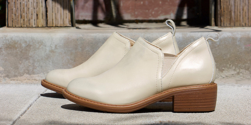 Merle Gold Cream bootie with luxurious leather upper and double elastic gores for slip on ease.