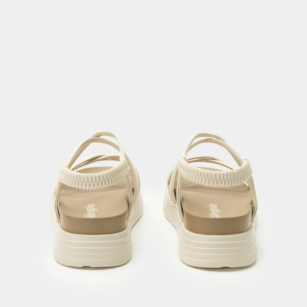 Audie Crème Brulee sandal on an Elevated sport outsole | Cream colored strappy sandal.