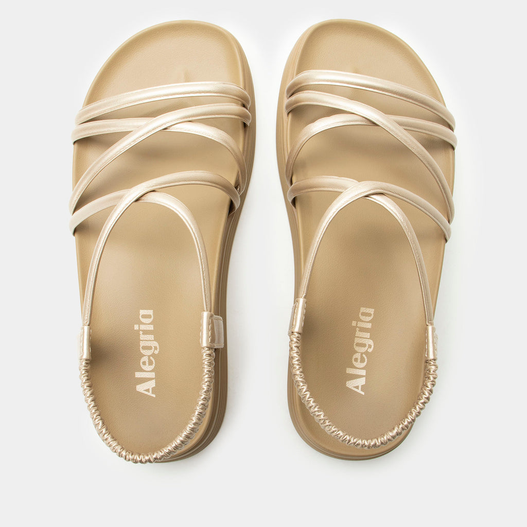 Audie Champagne sandal on an Elevated sport outsole | Gold colored strappy sandal.