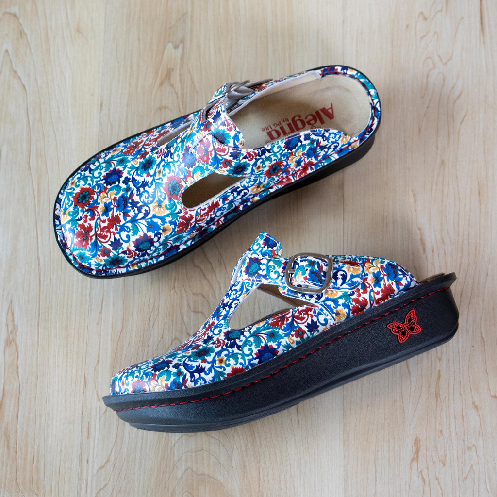 Classic Primary Party open back clog on a classic rocker outsole | Clog with multi color flowers on  a leather upper.