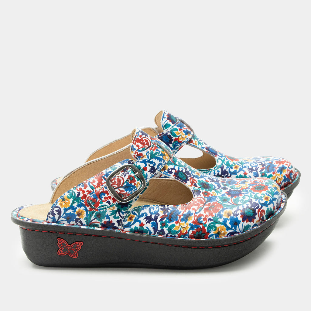 Classic Primary Party open back clog on a classic rocker outsole | Clog with multi color flowers on  a leather upper.