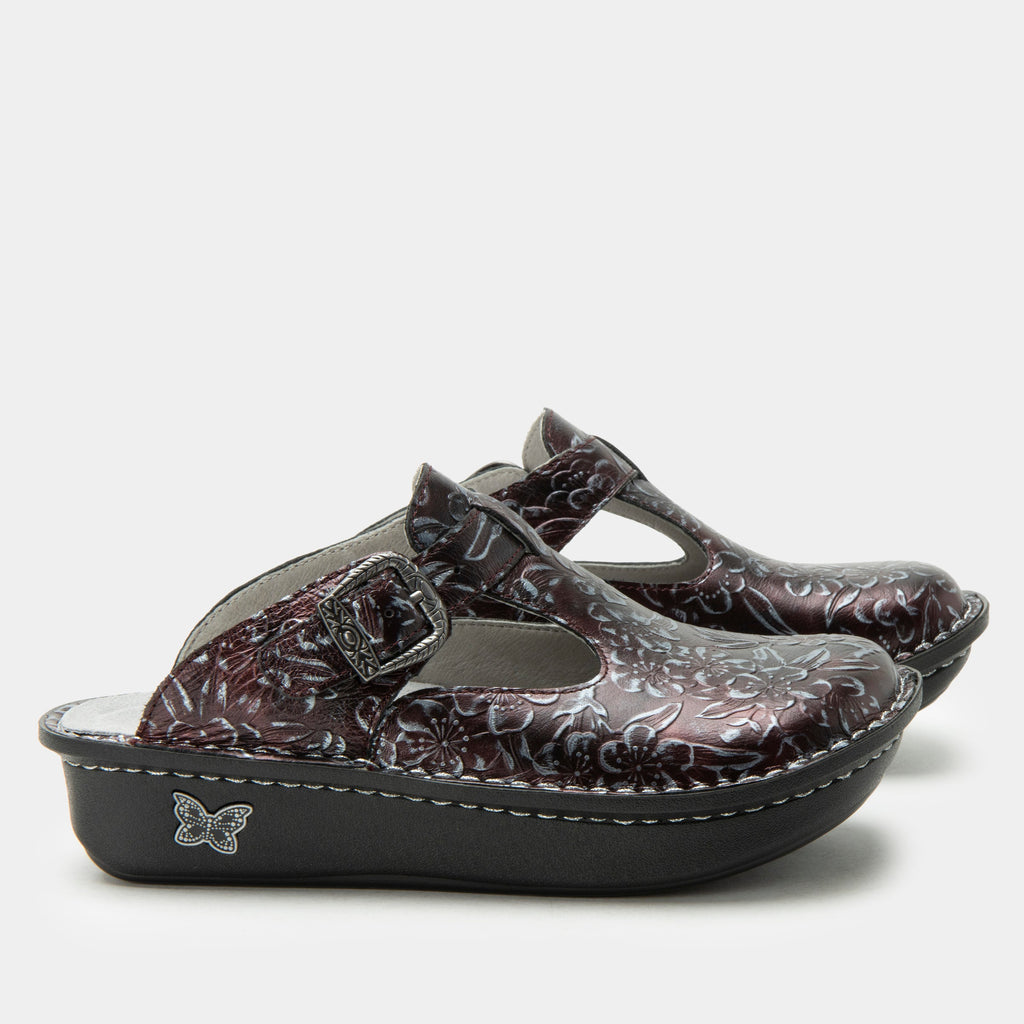 Classic Rosewood open back clog on a classic rocker outsole | Navy clog with emobossed flowers on leather uppers.