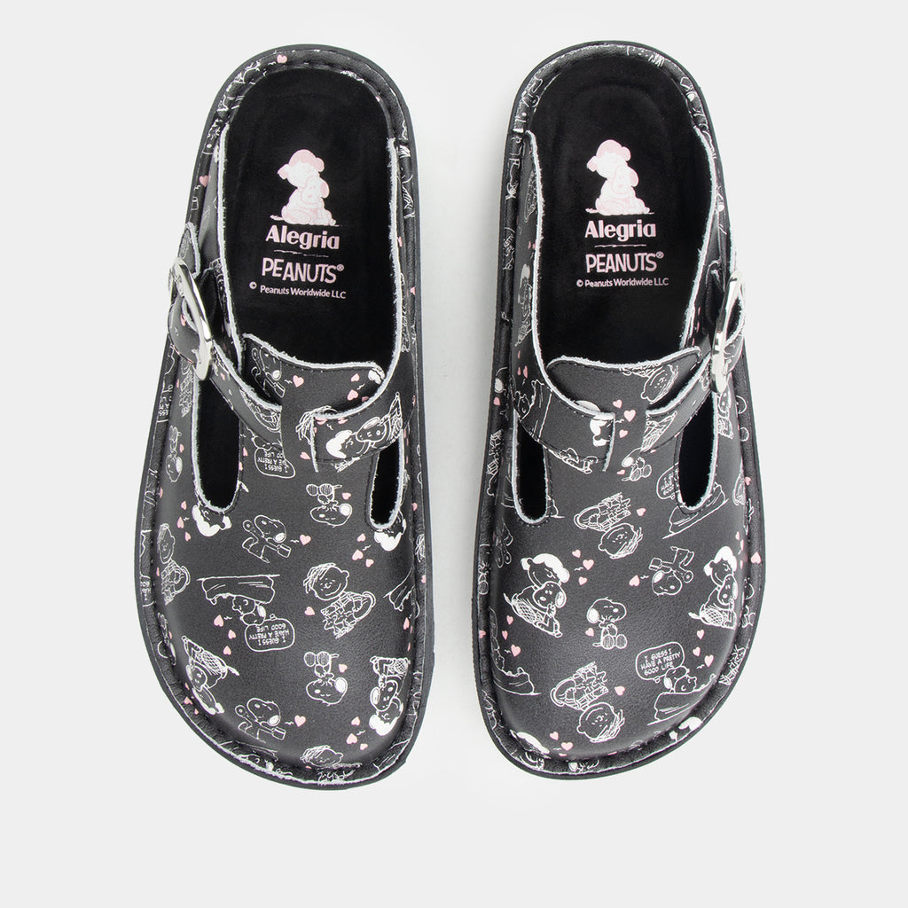 Classic Black Snuggles Top view of Black clog featuring Peanuts® character doodle on a Classic rocker outsole- showing black and white snuggle print with small pink hearts.