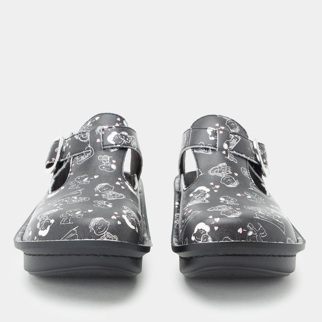 Classic Black Snuggles Front and toe view of Black clog featuring Peanuts® character doodle on a Classic rocker outsole- showing the side cut outs and adjustable strap over instep.