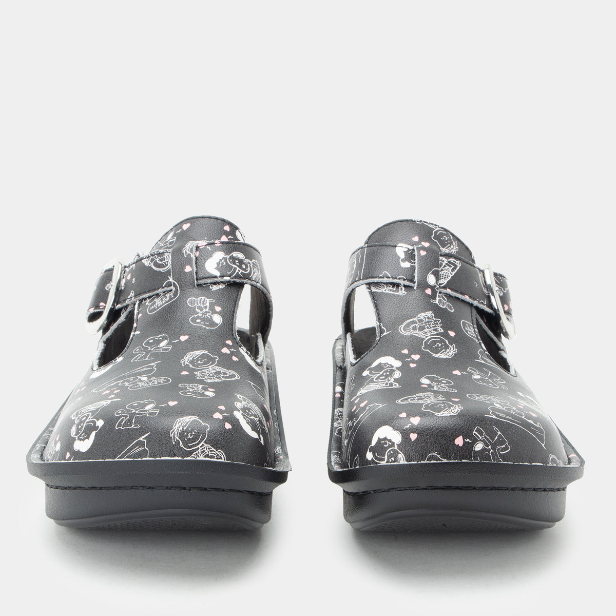 Classic Black Snuggles Front and toe view of Black clog featuring Peanuts® character doodle on a Classic rocker outsole- showing the side cut outs and adjustable strap over instep.