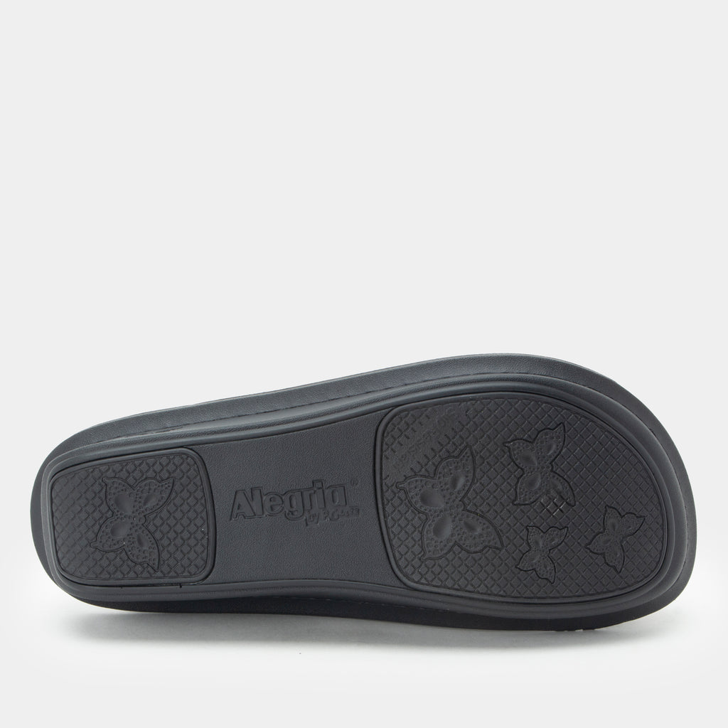 Classic Black Snuggles Bottom view showing the textured outsole.
