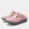 Classic Rose Snuggles Three-quarter view of a pink slip on clog featuring Peanuts®  character doodle on a Classic rocker outsole.