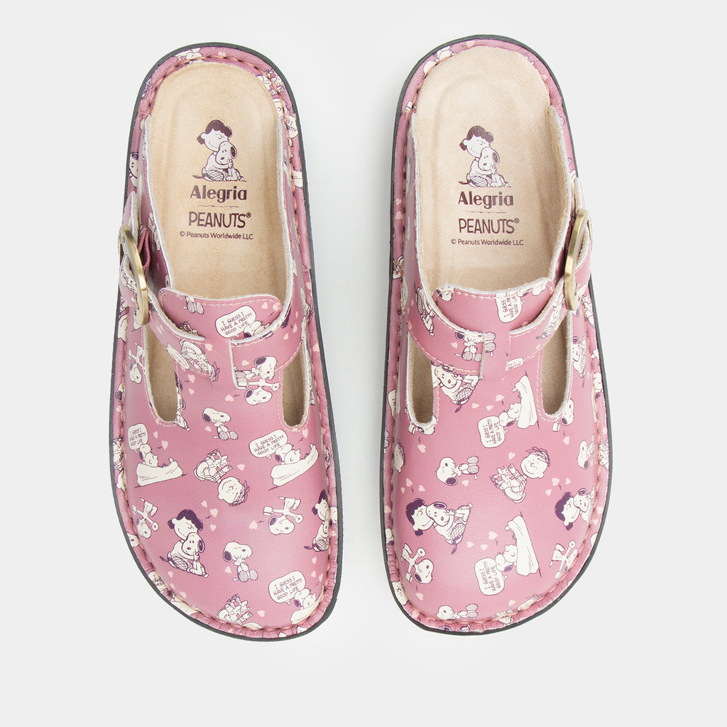 Classic Rose Snuggles Top view of a pink clog featuring Peanuts®  character doodle on a Classic rocker outsole- showing black and white snuggle print with small hearts on a printed pink leather upper.