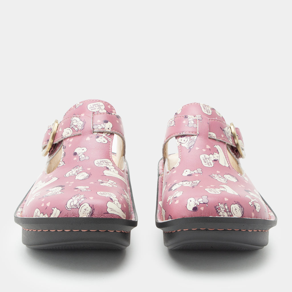 Classic Rose Snuggles Front and toe view of a pink clog featuring Peanuts®  character doodle on a Classic rocker outsole- showing the side cut outs and adjustable strap over instep.
