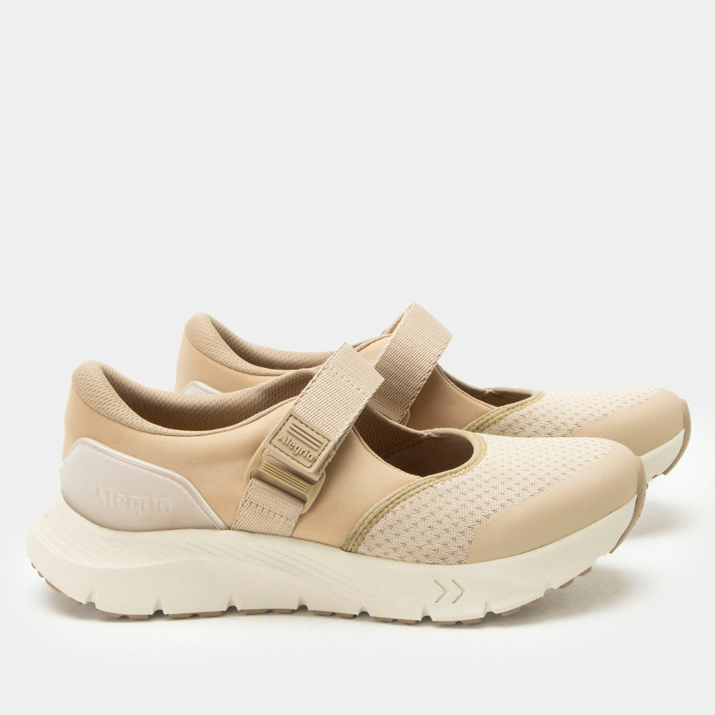 Atlis Dunes shoe on a lightweight EVA Rebounce outsole. | Tan mary jane style tennis shoe with adjustable strap.