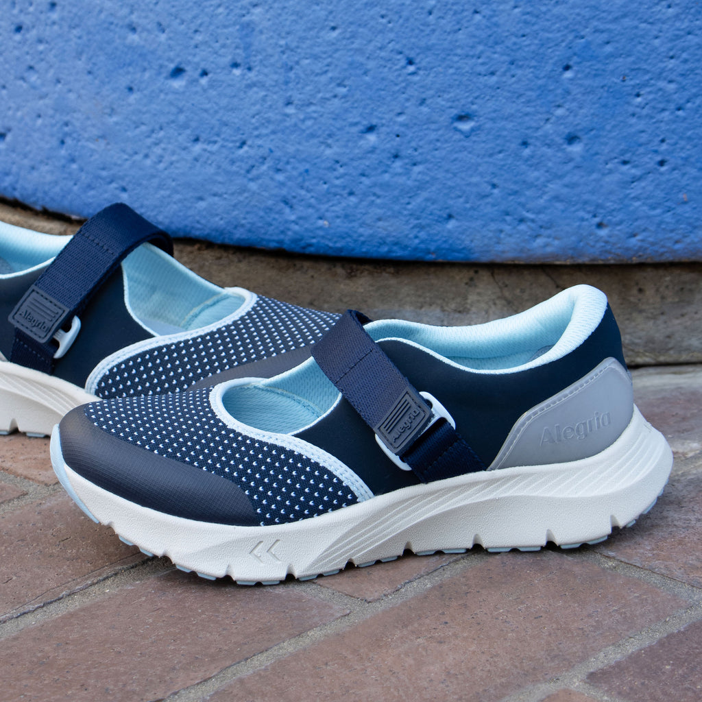 Atlis Blue Ice shoe on a lightweight EVA Rebounce outsole. | Navy mary jane style tennis shoe with adjustable strap.