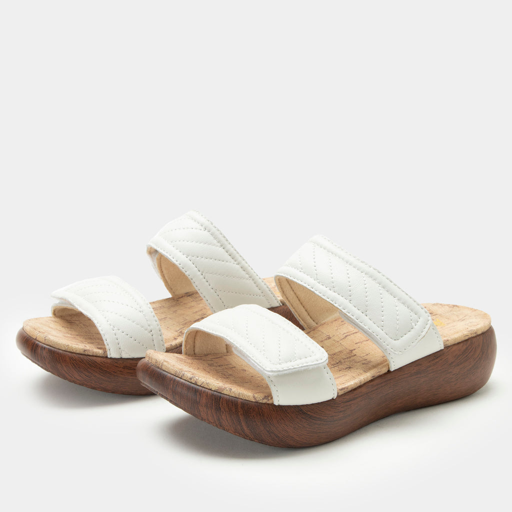 Brayah White adjustable sandal with non-flexing sleek rocker bottom with built in arch support 