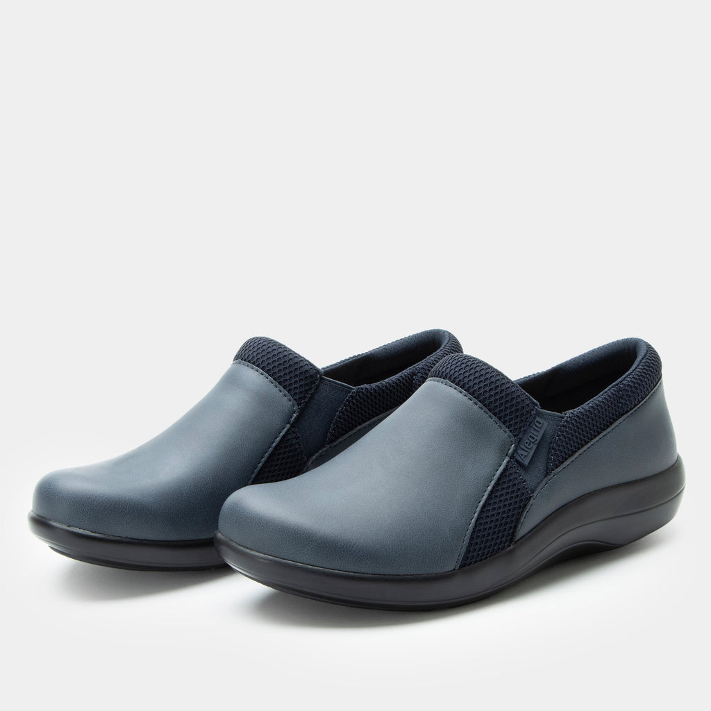 Duette Washed Navy sport rocker shoe on a lightweight responsive polyurethane outsole | A Navy vegan leather slip on shoe with textile lining.