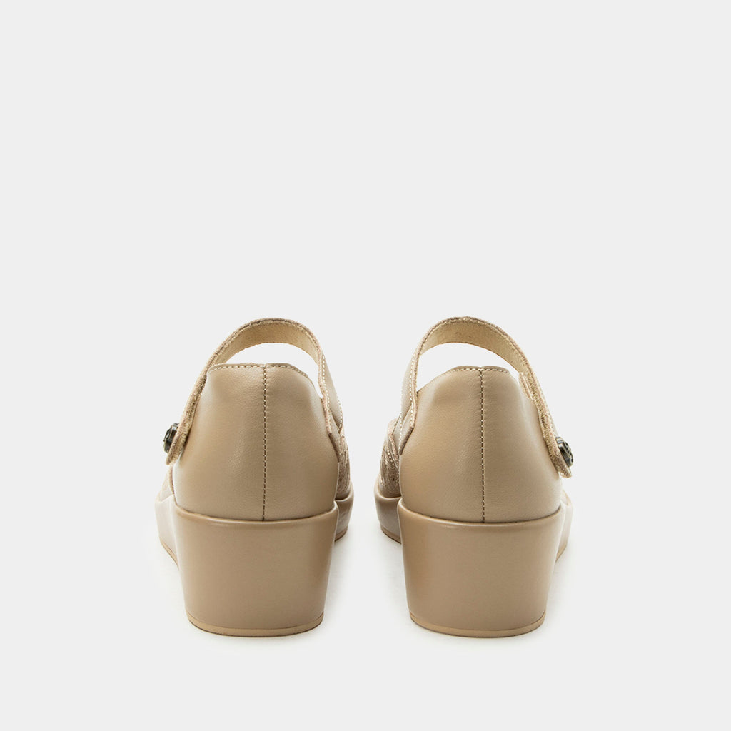 Hayes Beige Breeze Shoe on a Trimform wedge outsole | Beige leather mary jane shoe with laser cutouts on a wedge heel outsole.