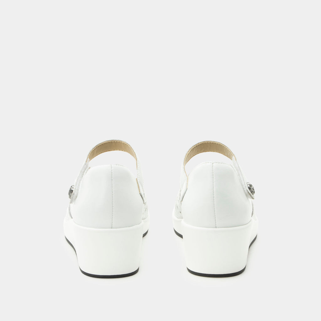 Hayes White Breeze Shoe on a Trimform wedge outsole | White leather mary jane shoe with laser cutouts on a wedge heel outsole.