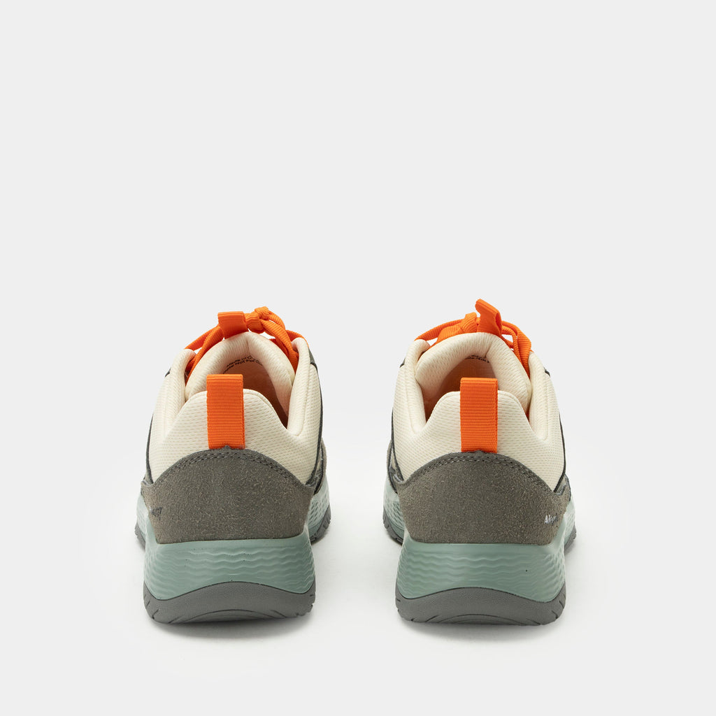 Motov8 Juniper shoe on a Ergo Flo outsole. | Tan multi colored lace up shoe with orange laces on water repelling Liquid Shell™ uppers.