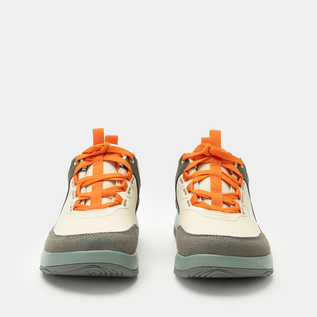 Motov8 Juniper shoe on a Ergo Flo outsole. | Tan multi colored lace up shoe with orange laces on water repelling Liquid Shell™ uppers.