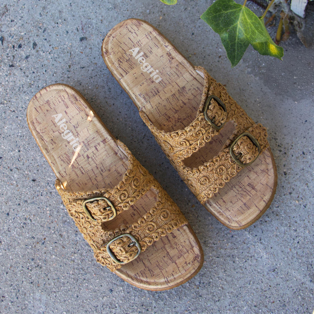 Oona Natural sandal on a Wood look rocker outsole | Slide on sandal with two straps and a tan braided leather upper.