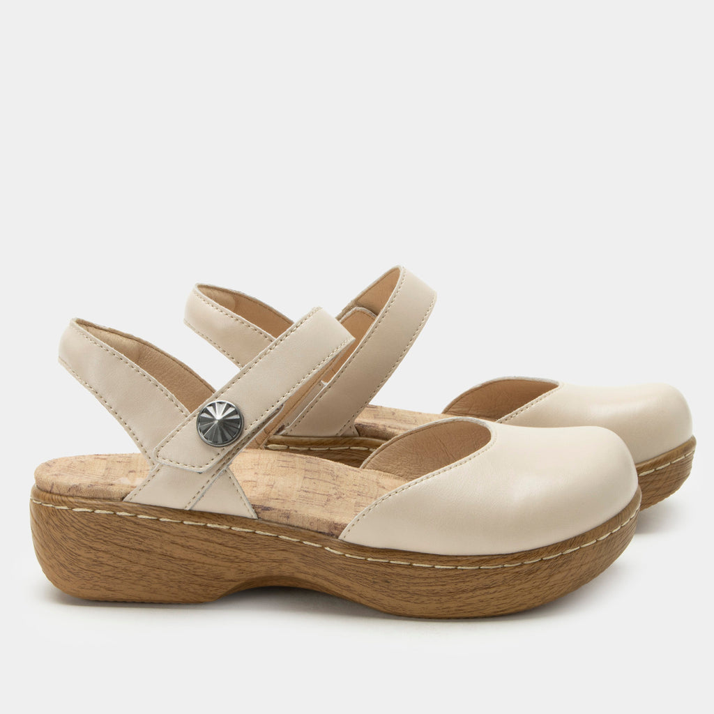 Opal Oat mary jane shoe on a Wood look rocker outsole | Mary jane style with a cream leather upper.