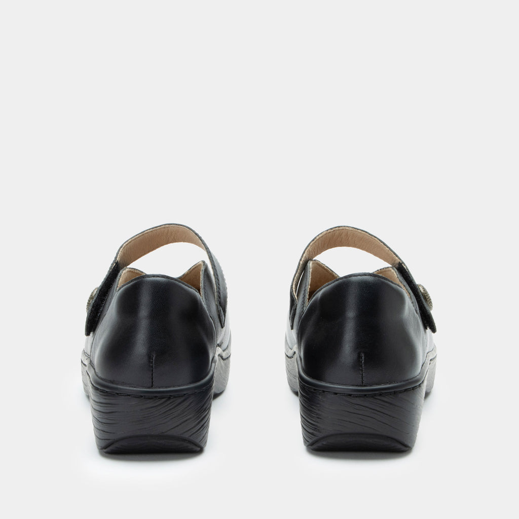 Opheliah Black slip on style shoe on a Wood look rocker outsole |Black leather with a black outsole.