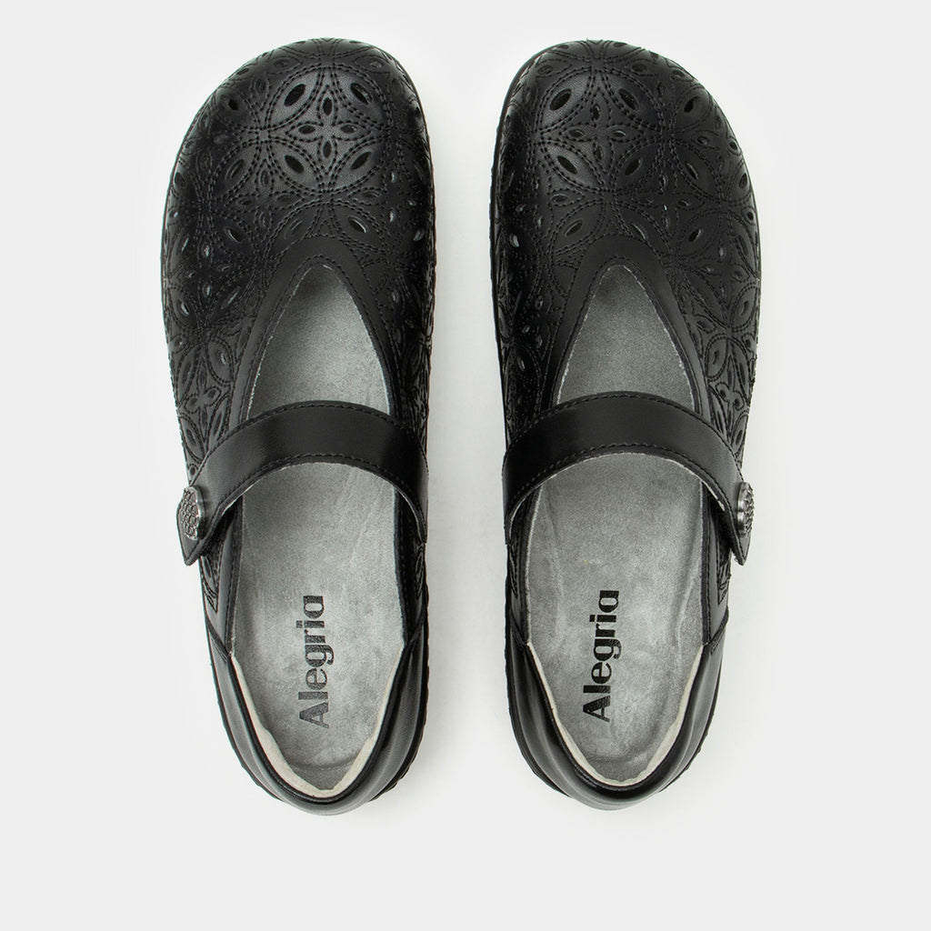 Opheliah Black Breeze slip on style shoe on a Wood look rocker outsole | Black leather upper with laser cutouts and stitching details.