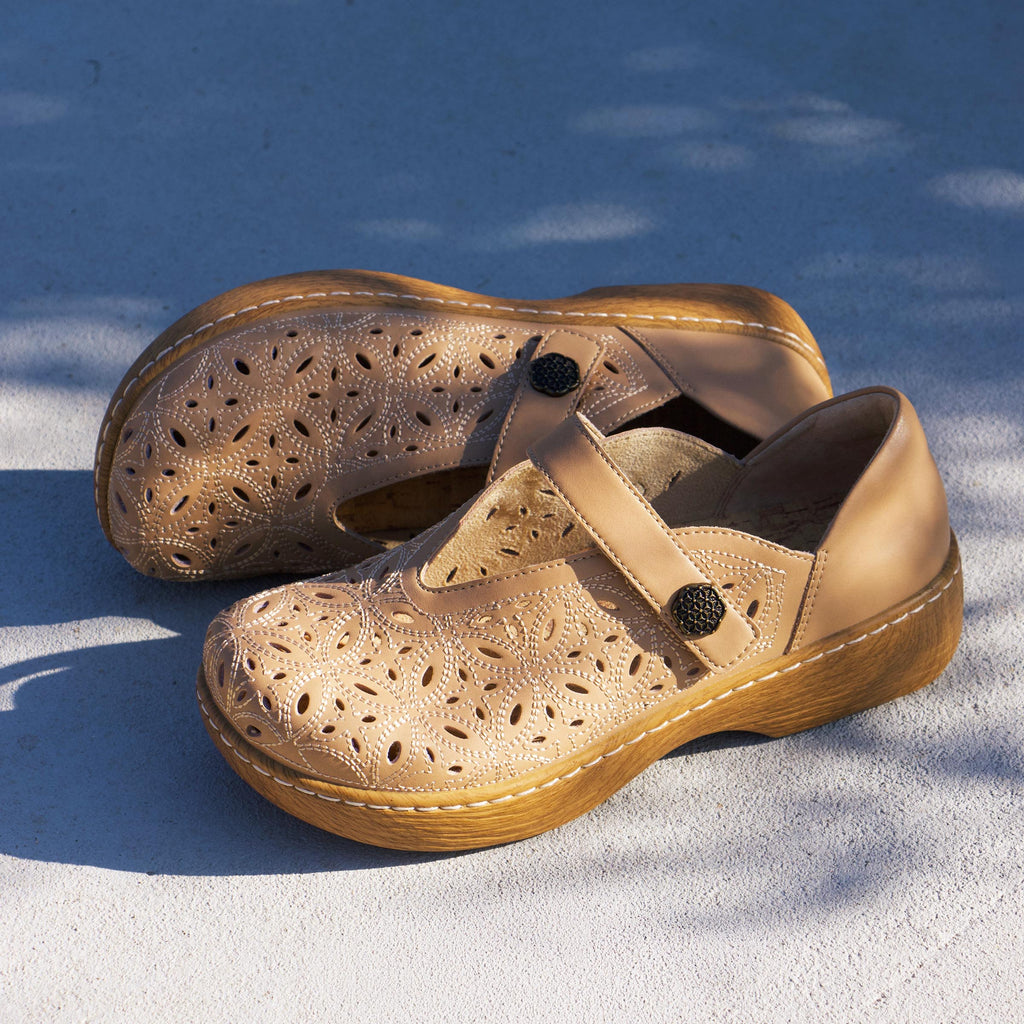 Opheliah Latte Breeze slip on style shoe on a Wood look rocker outsole |Tan leather upper with laser cutouts and stitching details.