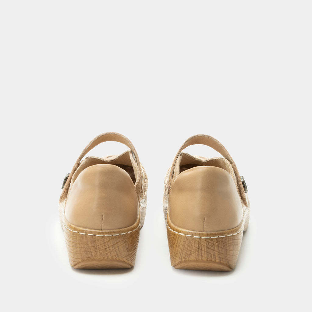 Opheliah Latte Breeze slip on style shoe on a Wood look rocker outsole |Tan leather upper with laser cutouts and stitching details.