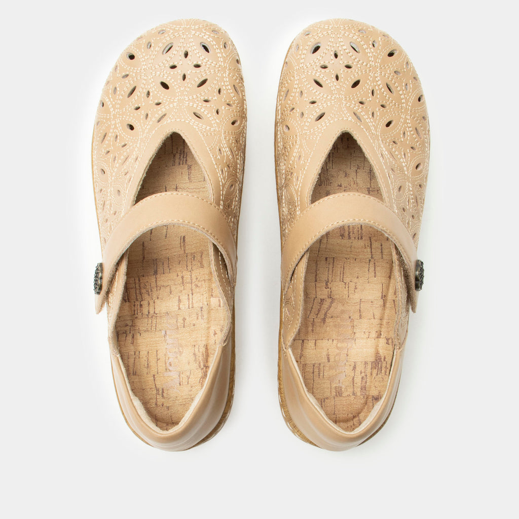 Opheliah Latte Breeze slip on style shoe on a Wood look rocker outsole |Tan leather upper with laser cutouts and stitching details.