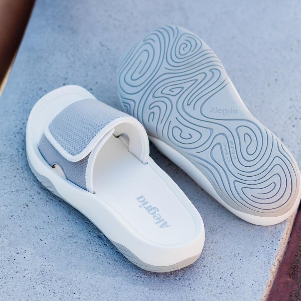 Ova8tion Dove sandal on a Ergo Foam outsole | White and grey slide on sandal with a mesh upper and lining.