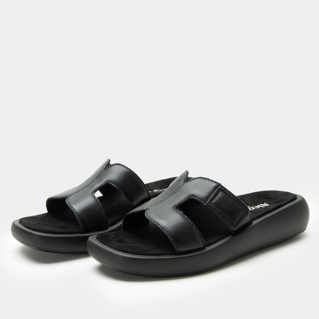 Portia Black sandal| Black leather slide on sandal on a lightwight outsole.