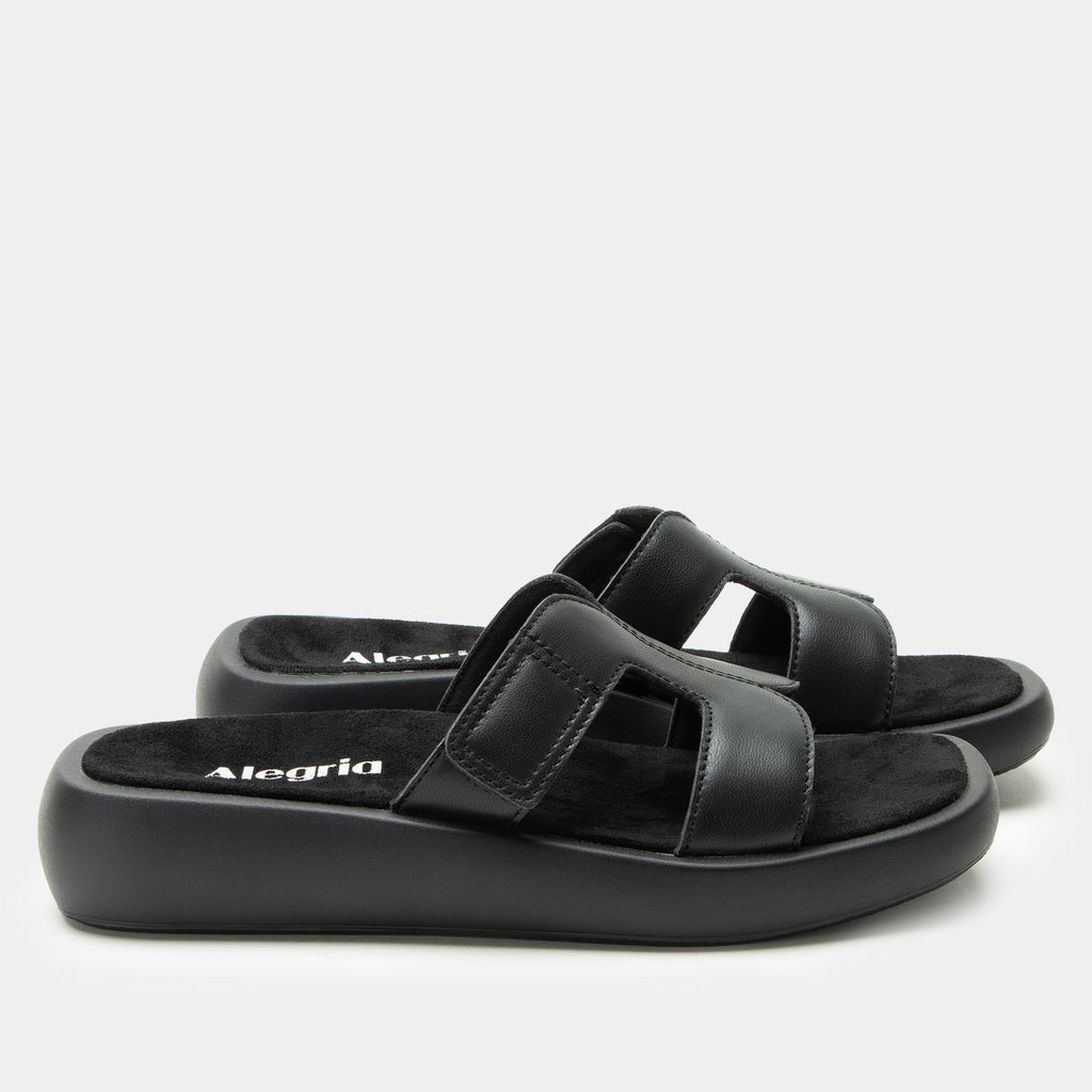 Portia Black sandal| Black leather slide on sandal on a lightwight outsole.