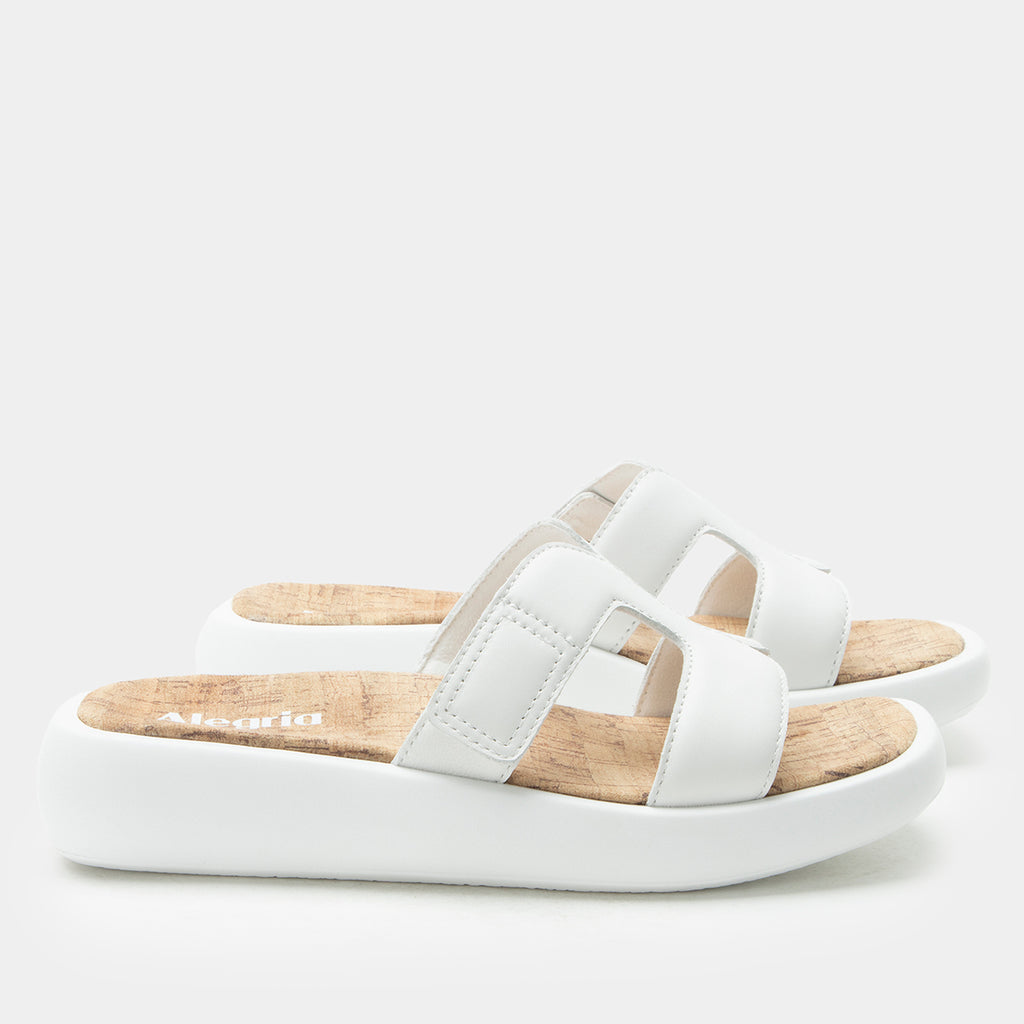 Portia All White sandal| white leather slide on sandal on a lightweight outsole.