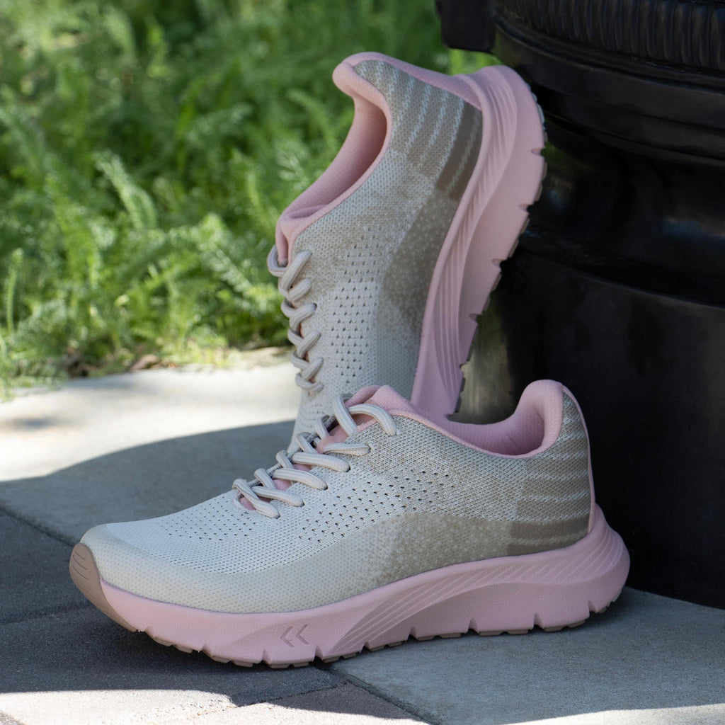 Revl Blush shoe on a lightweight EVA Rebounce outsole | Lace up shoe with a tan knit upper and pink outsole.